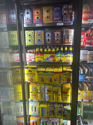 Refrigerated case stocked with Twisted Tea beverages