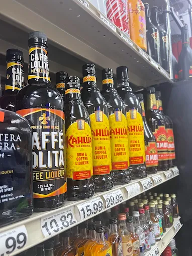 Assorted coffee liqueur bottles on a shelf